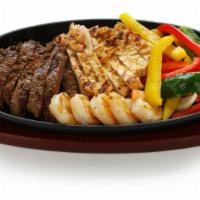 Chicken, Steak & Shrimp Fajitas · Delicious marinated shrimp, chicken and steak sautéed with bell peppers and onions, served o...