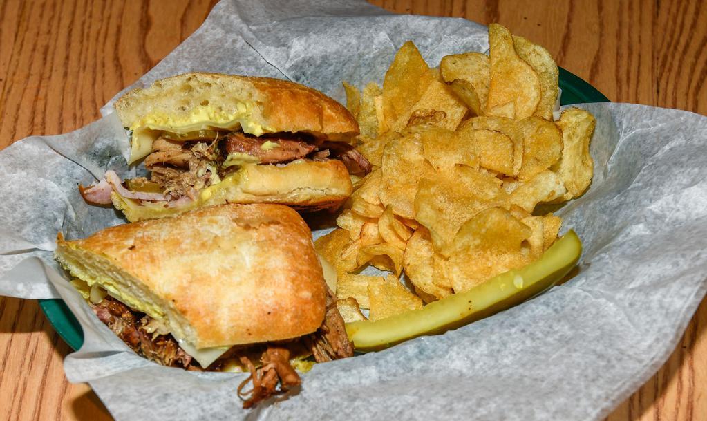Cubano Sandwich · Pat’s BBQ pulled pork, smoked ham, Swiss cheese, dill pickle, and mayo/mustard aioli, served on a ciabatta roll.