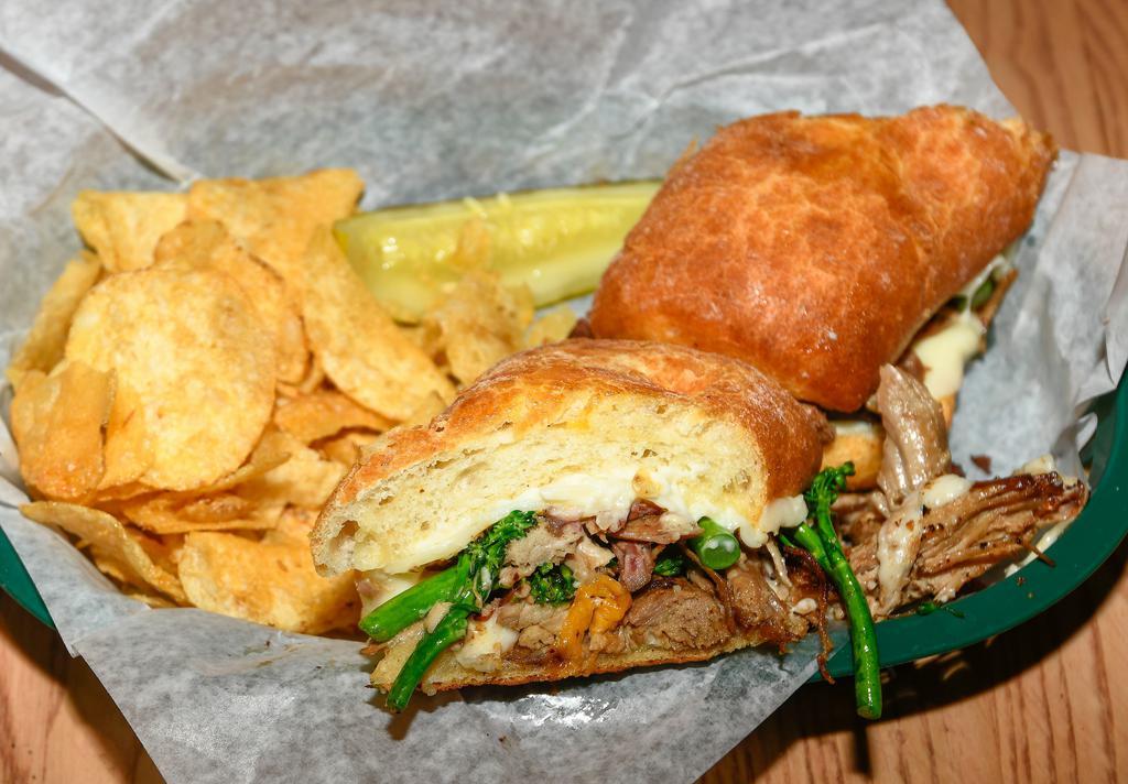 Philly Pork Sandwich · Pat’s BBQ pulled pork, provolone, . broccolini, and garlic mayo, served . on a ciabatta roll.