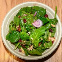 Spinach Salad · Baby spinach, feta cheese crumbles, . red onion, slivered almonds, candied walnuts, dried cr...