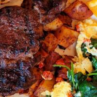 Steak & Eggs · Grilled rib eye steak 8oz, three eggs scrambles with spinach, roasted red peppers and Gorgon...
