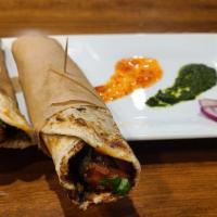 Chicken Coconut Korma  Kathi Rolls · Coconut Crème lovers would not go wrong with this roll. Choice of protein and vegetables tos...