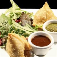 Vegetable Samosas (2 Pieces) · Golden fried flaky pastry, served with chutney.