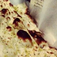 Naan · Leavened flour bread with cilantro.