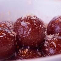 Gulab Jamun · Deep-fried cheese balls made from dry milk and served in aromatic rose water. Served warm.