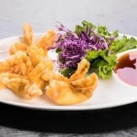 Crab Wontons · Crispy-fried wontons stuffed with a combination of imitation crab meat and cream cheese, ser...