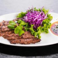 Grilled Beef · Tender slices of grilled  New York strip steak served with homemade chili dipping sauce.