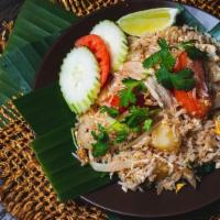 Pineapple Fried Rice · A popular Thai variation on fried rice, this dish adds pineapple pieces and includes stir-fr...
