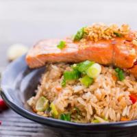 Salmon Garlic Fried Rice · Jasmine rice stir-fried with eggs, onions and grilled salmon with garlic butter sauce.