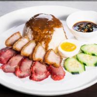 Bbq Pork & Crispy Pork Belly Over Rice · BBQ pork, crispy pork belly and medium- boiled egg served over rice and topped with sweet an...