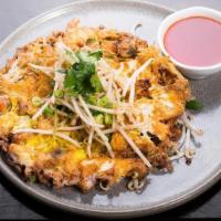 Crispy Mussels Pancake · Pan-fried mussels pancake with eggs, bean sprouts and green onion, served with homemade chil...
