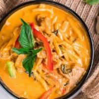 Red Curry · Red chili paste, basil, Kaffir lime leaves, bamboo shoots and bell peppers  simmered in coco...