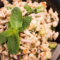 Larb · Red onions, green onions, cilantro, chili, lime juice, and ground toasted rice powder with g...