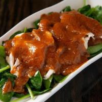 Swimming Rama · Sautéed chicken pieces, served on a bed of spinach and topped with our famous peanut sauce. ...