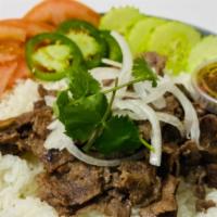 Steak Rice Bowl · Served with white rice, cucumbers, tomatoes, onions, jalapeño & cilantro  with your choice o...