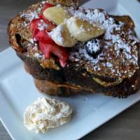 French Toast · Topped with mixed berries, bananas, and whipped cream.