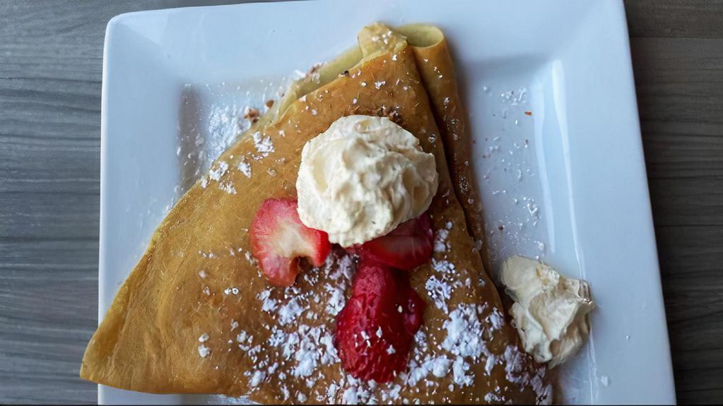 Strawberry Short Crêpe · Strawberries, whipped cream, and Bischoff cookies.