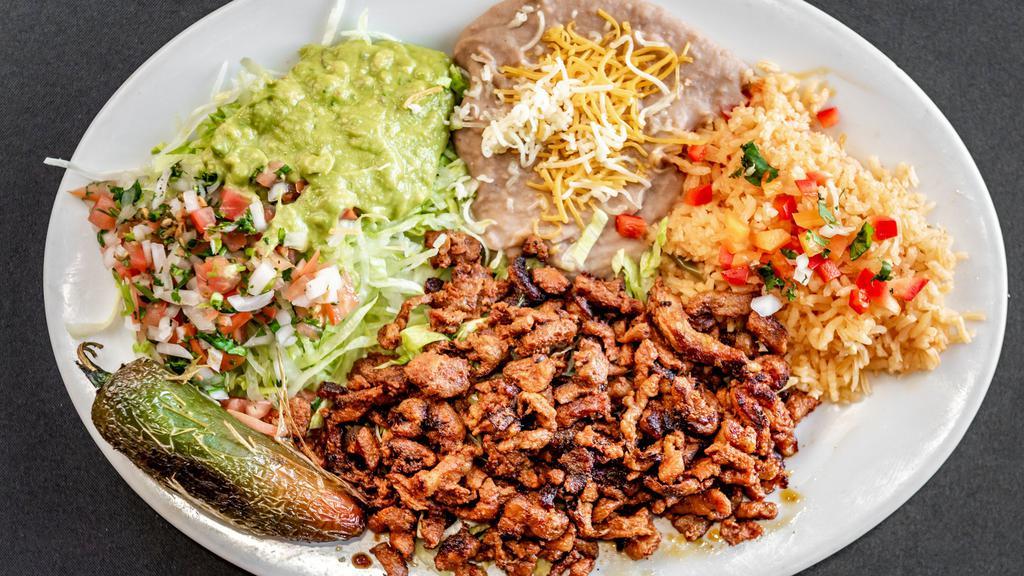 #15 Adobada Plate · (Marinated Pork). Choice of flour or corn tortilla.
With lettuce, pico and guacamole.