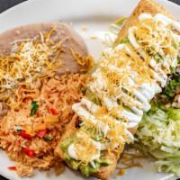 #13 Chicken Chimichanga · Shredded chicken (Cooked with onions, tomato, and bell pepper).
Inside burrito: chicken, bea...