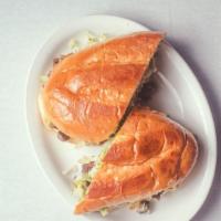 Torta · A massive Mexican sandwich made with fresh baked bread, your choice of protein, refreid bean...