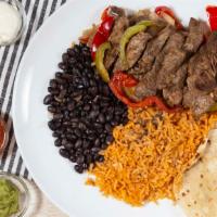 Steak Fajitas · A delicious serving of marinated steak (8oz), charbroiled and served over freshly grilled fa...