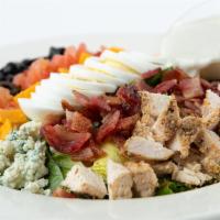 Classic Cobb · Served with bacon, chicken, hard-boiled egg, diced cheddar cheese, tomato, olives & blue che...