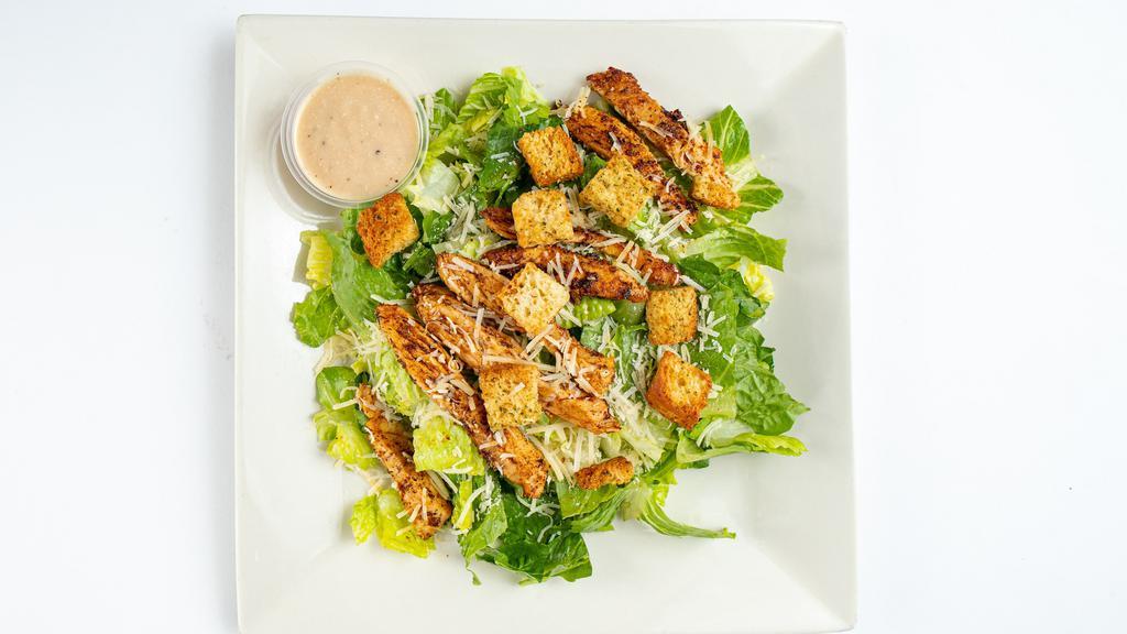 Caesar · Served with Parmesan cheese and croutons and Caesar dressing.  Add grilled regular or blackened chicken if desired