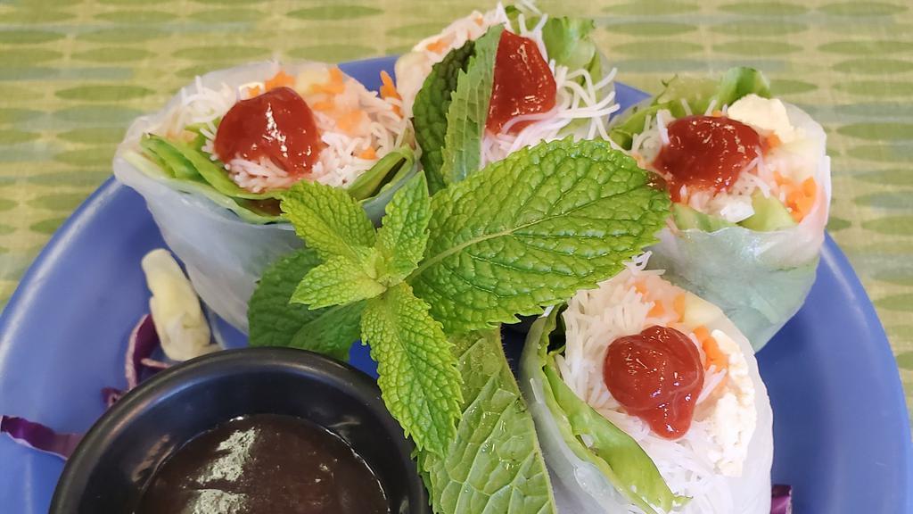 Fresh Spring Rolls · Shredded braised chicken in a tom yum broth, rice noodles, pickled root vegetables, cucumber, carrots, mints, cilantro and green leaf, tucked in rice paper and served with plum peanut sauce. Vegan option is available.