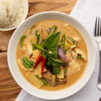 Red Curry (Gang Ped) · House's special red curry paste with chicken or pork in a perfect blend of Thai dry chilies,...