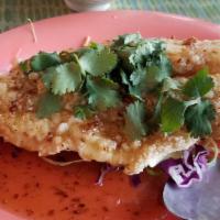 Sweet Crispy Garlic Tamarind Fish · Boneless white fish filet, flash fried, topped with a sweet garlic tamarind sauce, garnished...