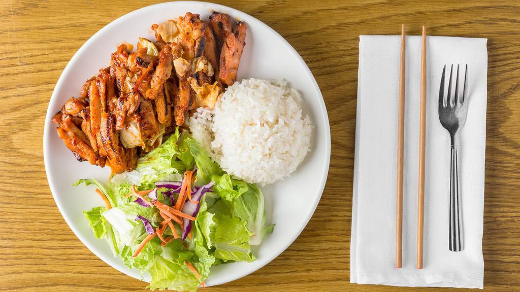 Spicy Chicken · Chicken stir-fried with vegetables. Served with fresh salad and steamed rice.