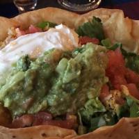 Taco Salad Cazuela · A bowl-shaped flour tortilla deep-fried and filled with beef or chicken, lettuce, tomatoes, ...