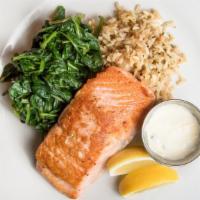 Salmon Filet · Lemon caper sauce, rice pilaf, sautéed spinach.