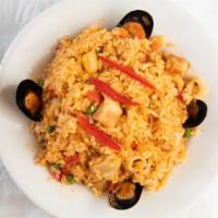 Arroz Con Mariscos · Is Peruvian rice with seafood. It usually also has fish, octopus, squid and
scallops