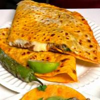 Quesadilla · Extra Large Flour tortilla filled with your choice of meat and cheese.  Inside carries cilan...