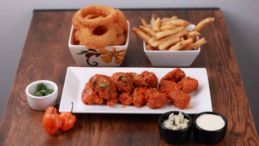 Boneless Wings - 6 Pieces · (6) Large all white meat Boneless Wings. Served with a side of Ranch. Choice of: Naked, Honey BBQ (extra charge), Buffalo Medium Wing Sauce (extra charge)