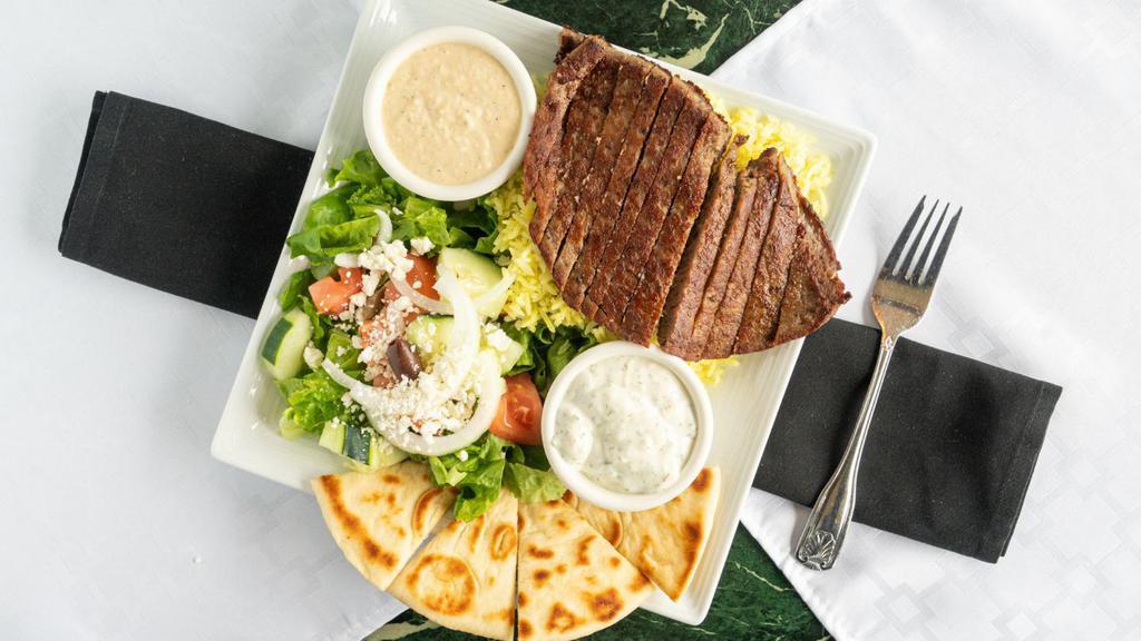 Gyro Plate · Grilled beef and lamb mix served with basmati rice, pita bread, tzatziki sauce, hummus and greek salad.