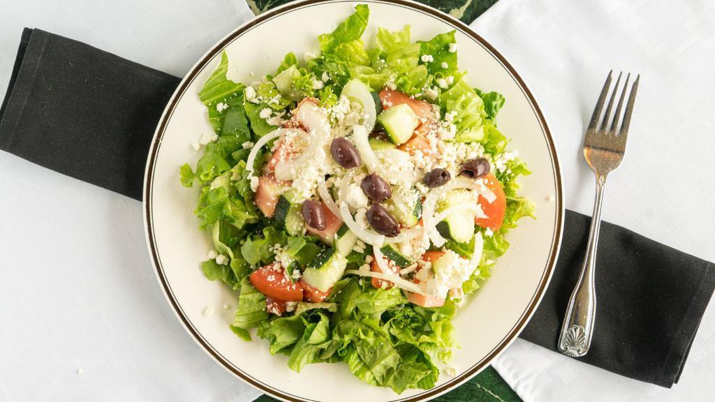 Greek Salad · Fresh lettuce, tomatoes, onions, cucumber, olives, feta cheese with tzatziki sauce and greek dressing.