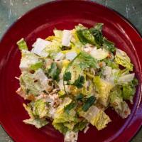 Chipotle Caesar Salad · Romaine hearts, chipotle dressing, crispy tortillas, pumpkin seeds.