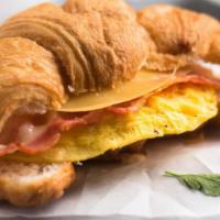 Eggs & Bacon  Croissant Sandwich  · Our Handcrafted butter croissant filled with scrambled eggs bacon & swiss cheese.