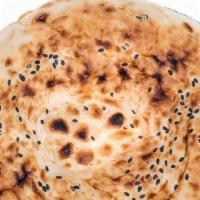 Sesame Naan · Fresh White flour bread baked with sesame seeds.