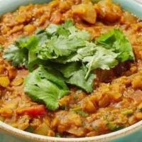 Daal Turka · Lentils cooked with tomatoes, onion and garlic with ground spices.