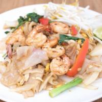 Pad Kee Mao · Wide rice noodles stir-fried with egg, onions, bell peppers, fresh chili, garlic, and basil ...