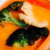 House Curry · Red curry and peanut sauce with coconut milk, bell pepper, carrots, and broccoli. Served wit...