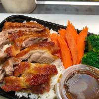 Khao Nah Phed · Roasted duck on rice served with duck sauce, steamed Chinese broccoli, broccoli, cucumber, a...