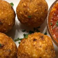Arancini Di Riso · Gluten-Free. Vegan. Deep-fried risotto balls, served with tomato sauce.