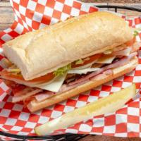Ultimate Club (Full) · On a fresh baked roll we put mayo, lettuce, tomato and onions. Then we add ham, turkey roast...