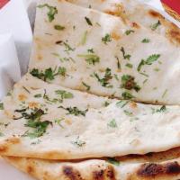 Garlic Naan · Leavened bread lightly sprinkled with fresh garlic.
