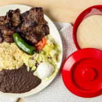 Carne Asada · Grilled skirt steak seved with rice, beans, sour cream, salad and your choice of tortillas.