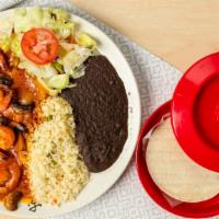 Camarones Al Mojo De Ajo · Sauteed prawns with mushrooms, onions and garlic sauce. Served with rice, beans, salad and y...
